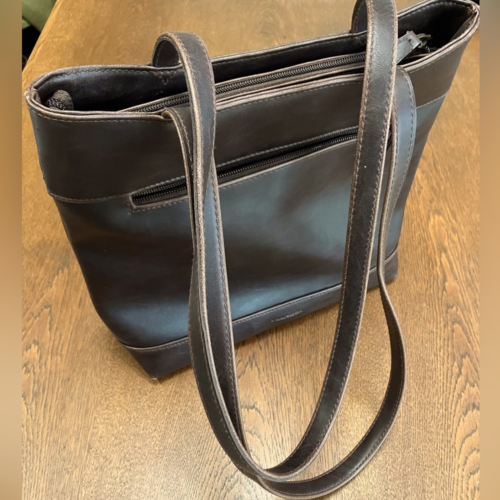 Vintage Villager Bag. Exc condition. Brown vegan leather. Zipper closure secure.